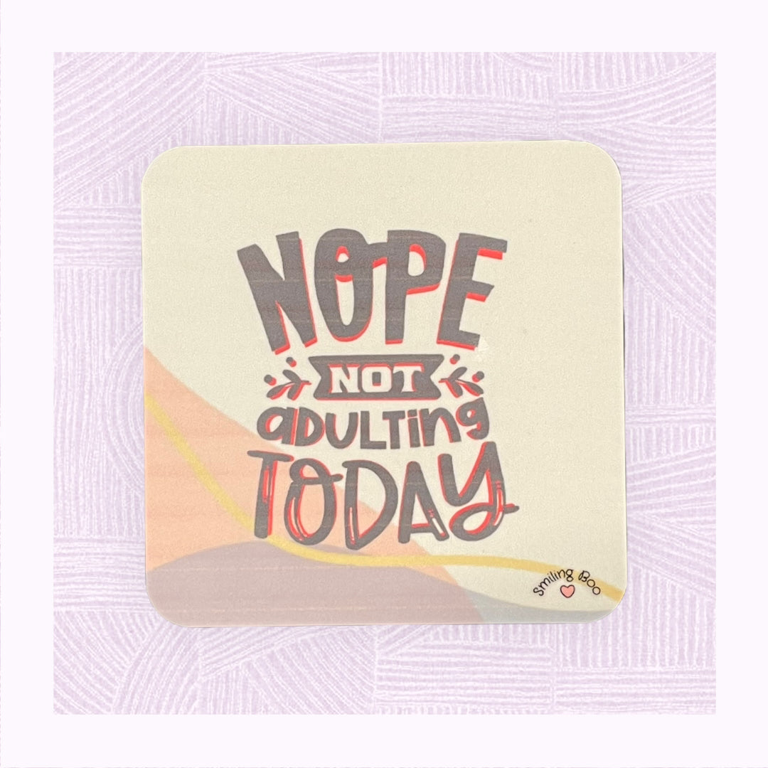 Square coaster with a pastel background and the phrase ‘Nope! Not Adulting Today’.