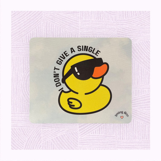 Rectangle mouse mat with a blue and white watercolour background and a rubber duck wearing sunglasses, with the phrase ‘I don’t give a single…’