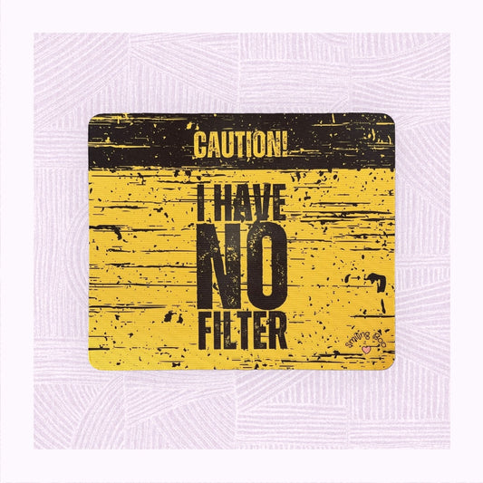 Rectangle mouse mat with a yellow and black distressed background, with the phrase ‘Caution! I Have No Filter’.