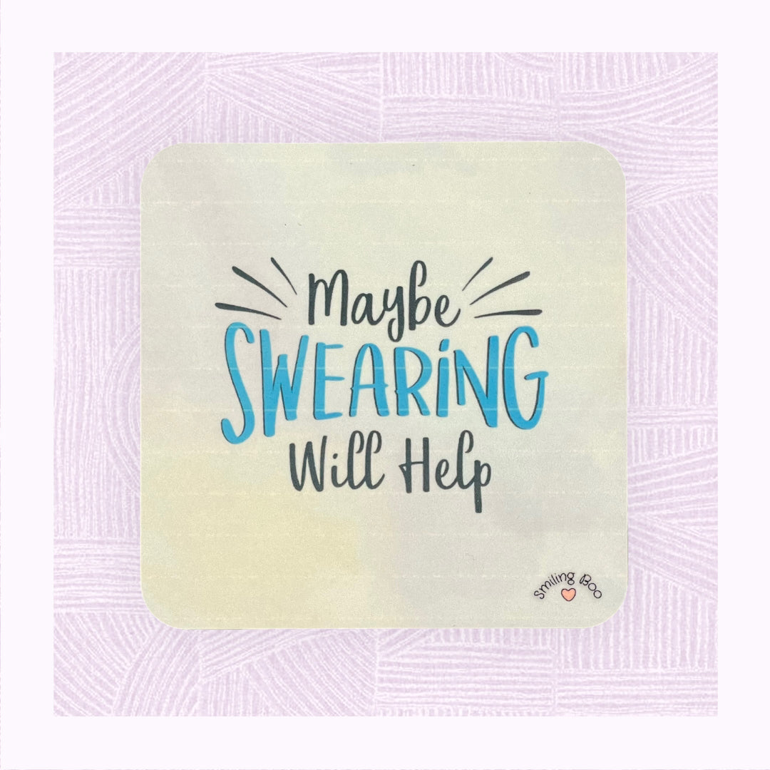 Square coaster with a blue pastel background and the phrase ‘Maybe swearing will help’ on it as if exploding off the coaster.