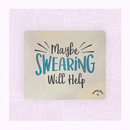 Rectangle mouse mat with a blue pastel background and the phrase ‘Maybe swearing will help’ on it as if exploding off the mug.