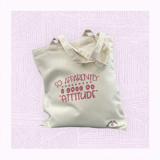 Canvas tote bag with the phrase ‘Apparently I have an Attitude’ in bubble font.